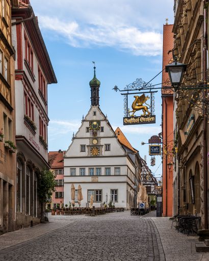 A Beautiful cobblestone street with typical old colorful german buildings in old town of the medieval fairytale Rothenburg ob der Taber