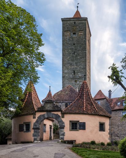 The historical Burg gatehouse with a tall stone tower on a sunny day in Rothenburg Ob der Tauber, Bavaria, Franconia, Germany