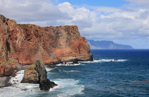 The majestic cliffs surrounded by blue waters. Vereda da Ponta de Sao Lourenco, Madeira, Portugal
