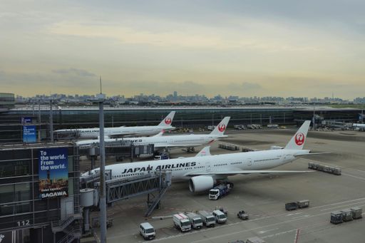 The view over the airfield of Tokyo's Haneda Airport with several Japan Airline planes