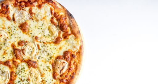 A closeup shot of traditional cheese pizza on a white background