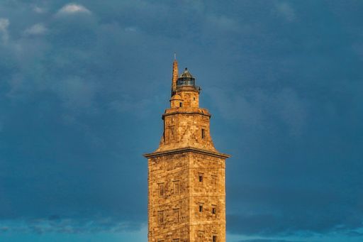 A beautiful shot of Tower of Hercules in A Coruna, Galicia, Spain with a cloudy blue sky in the background