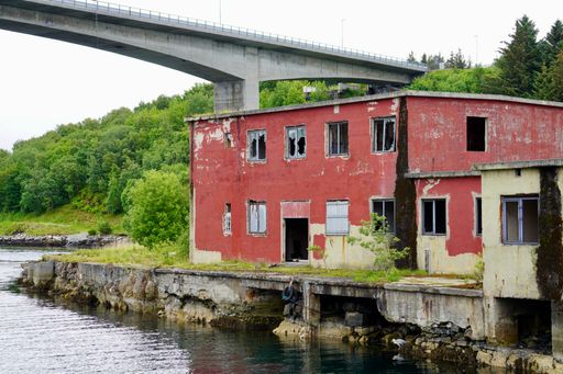 A derelict industrial building on the Nordholmen islet in the port city of Kristiansund on a cloudy day, Norway