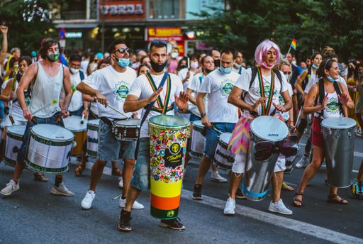 Portrait of Group of Men dressed in White Playing the Batucada Drums at the Gay Pride Demonstration