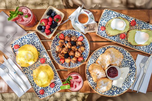A top view of breakfast table with tasty desserts