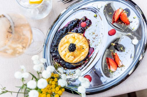 A top view of tasty pancakes with berries