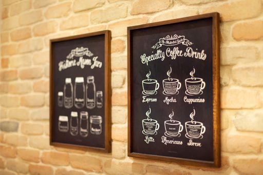 A closeup of a special coffee menu written on a blackboard with chalk in a coffee shop