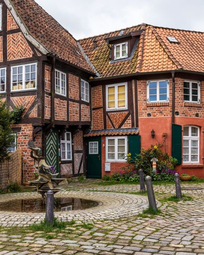 A street scene with traditional brick buildings in Luneburg, Lower Saxony, Germany
