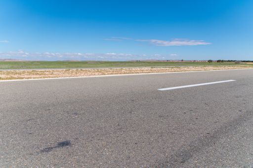 A smooth road passing through vast landscapes in Essaouira, Morocco