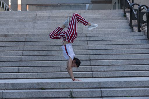young girl performing urban dance with different postures on the street on the street to be fit and have healthy lifestyle habits and have a healthy b
