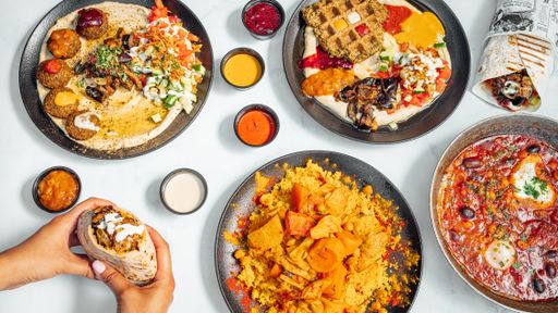 A dinner table with different types of delicious Mexican dishes