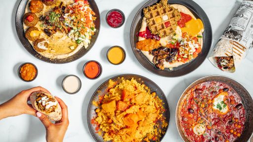 A dinner table with different types of delicious Mexican dishes