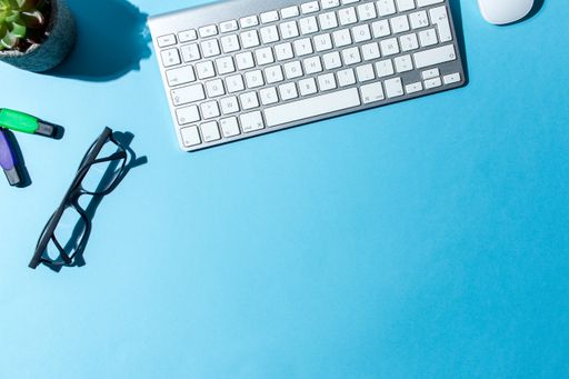 A work table with blue background and copy spaces