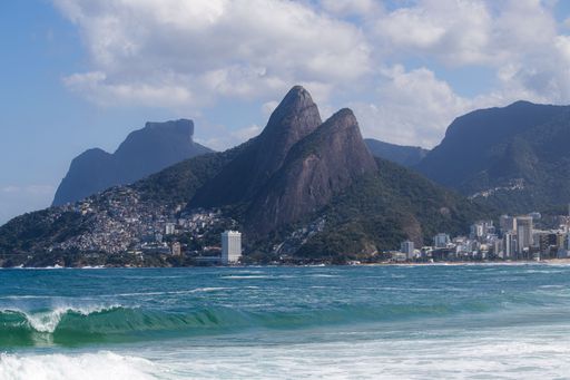A scenic view of the Two Brothers Mountain and the coastline of Rio de Janeiro on a sunny day