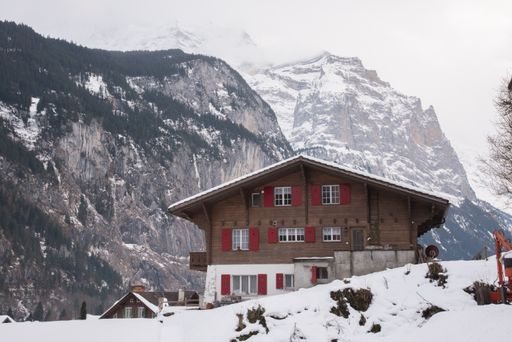 A small village surrounded by the snowy Swiss Alps in Lauterbrunnen, Switzerland