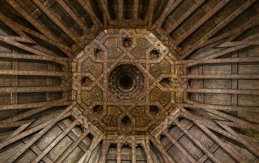 The intricate wood ceiling with detailed carvings in Burgos Cathedral