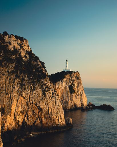 A vertical shot of the lighthouse on the Lefkada Island, Greece