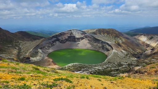 A scenic view of the volcanic crater lake Okama on the top of Mt. Zao in Japan