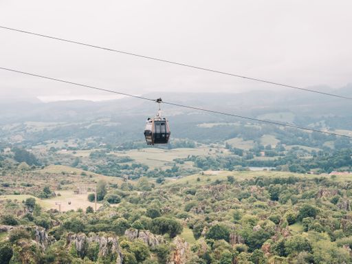 A beautiful shot of a cable car with mountains in the background in Cantabria, Spain