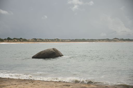 A Beautiful view of a rock in the ocean at the coast of Yala Safari in Sri Lanka