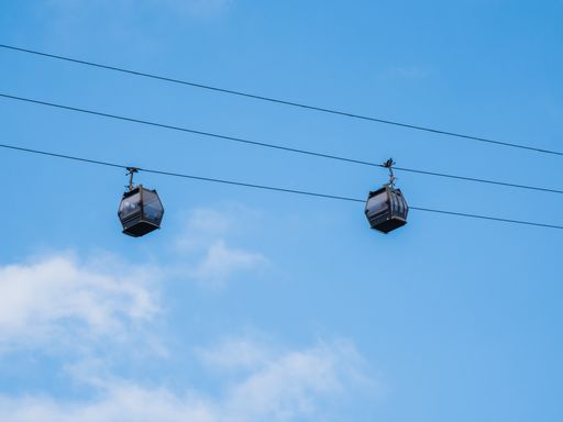 A beautiful shot of cable cars under blue sky i Cantabria, Spain