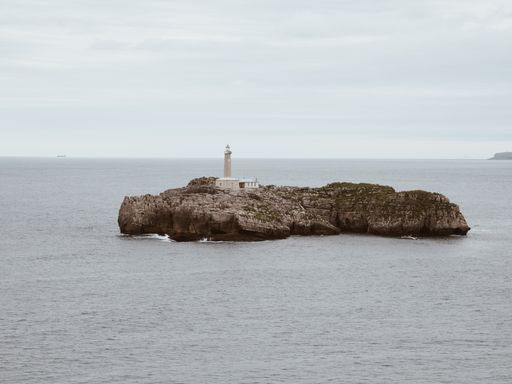 The Mouro Island Lighthouse or Faro De La Isla De Mouro in Santander city, Cantabria, Spain