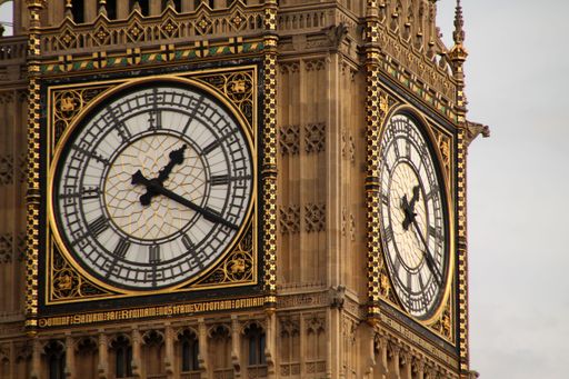 The clock face of Big Ben in London, showcasing intricate details and architecture.
