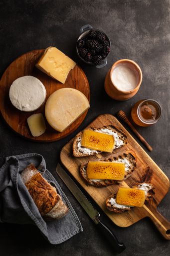 A top view shot of bruschetta and cheese platter