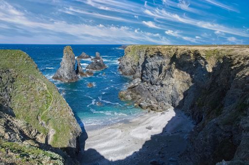 A scenic view of Belle-Ile in Brittany, seascape with rocks and cliffs on the Cote Sauvage, the needles of Port-Coton