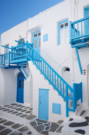 A vertical shot of the traditional whitewashed buildings of Santorini in Greece