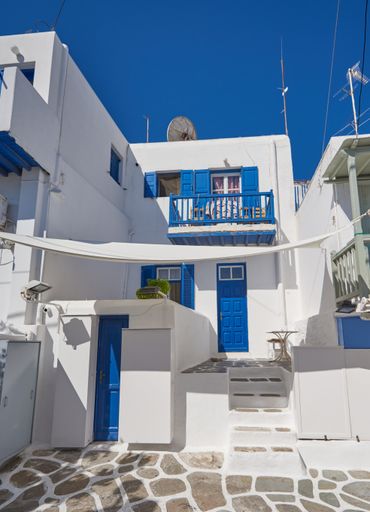 A vertical shot of the traditional whitewashed buildings of Santorini in Greece