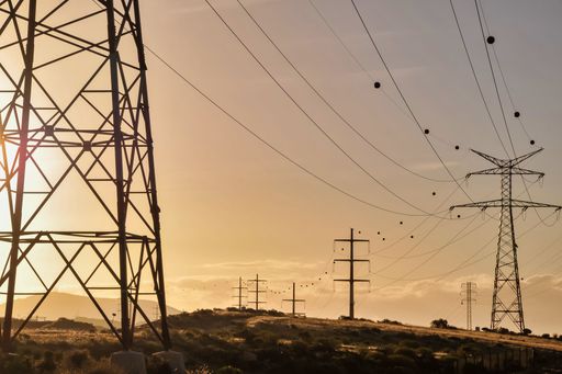 A shot of electricity points linked to each other with wires during the sunset in the evening.