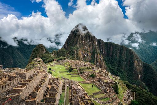 A breathtaking view of the Historic Sanctuary of Machu Picchu set high in the Andes Mountains in Peru on a sunny day