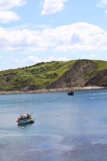 A scenic view of Lulworth Cove on the Dorset coast
