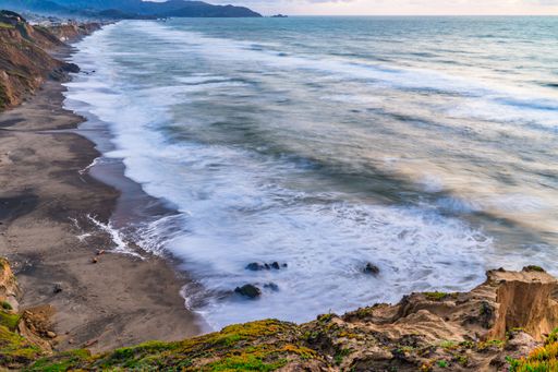 A scenic view of a sunset at Mussel Rock Park, Daly City, California.