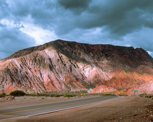 Beautiful landscape, red mountains, lake, blue sky with clouds, in northern argentina, Salta and Jujuy.