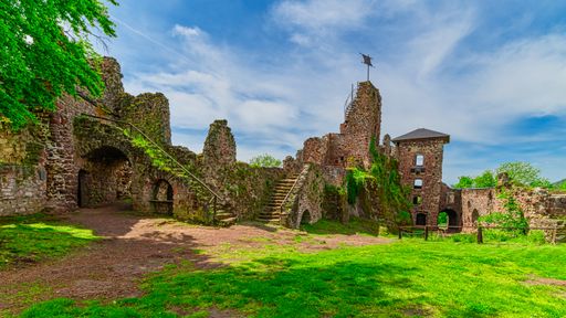 A view of the castle ruins in Hohnstein in the Harz near Nordhausen in Germany. Beautiful castle ruins in summer weather.