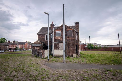 Last remaining terrace houses on site of former residential streets, now awaitung redevelopment, Stoke-on-Trent, UK.