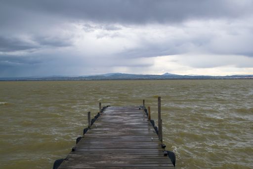 View of the jetty in La albufera during a cloudy day.