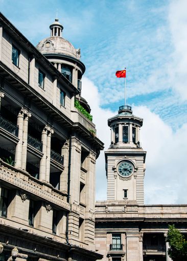 A century old European style building with magnificent architectural details, under a clear blue sky in Wuhan, China