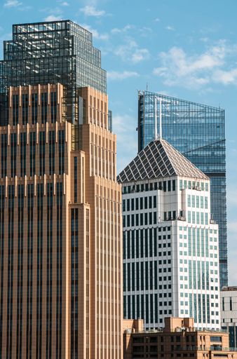 Under the blue sky, the magnificent skyscraper cluster in Wuhan Financial District has a modern exterior design. China