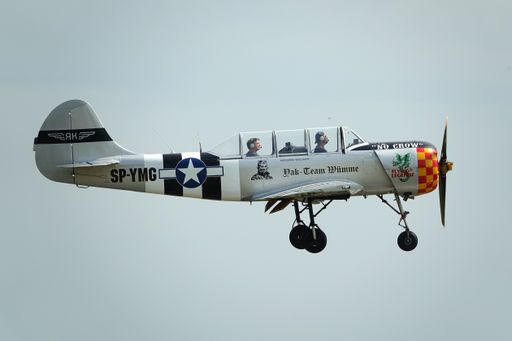 A beautiful old Yak 52 light trainer aircraft in the air