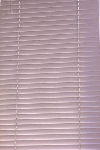 The white jalousie on a window in a room