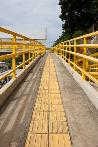 A vertical shot of a yellow bridge