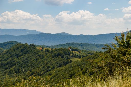 A mesmerizing view of a beautiful mountainous landscape under a cloudy sky
