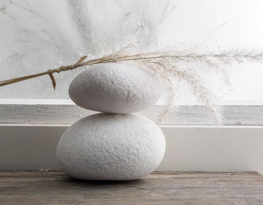A closeup shot of two stones on a wooden surface