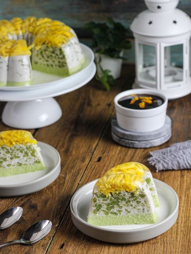 A high angle shot of delicious cake served in slices with coffee on a cafe table