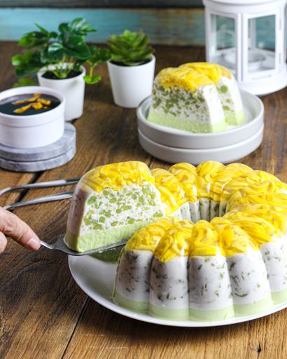 A high angle shot of delicious cake served in slices with coffee on a cafe table