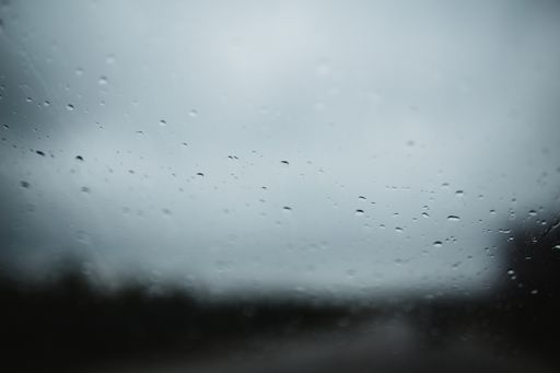 A closeup shot of raindrops on a window glass