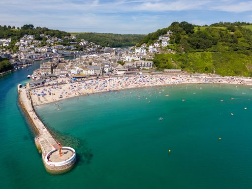 An aerial view of the Banjo Pier and Looe Beach on a sunny day in Looe town, Cornwall, England, UK